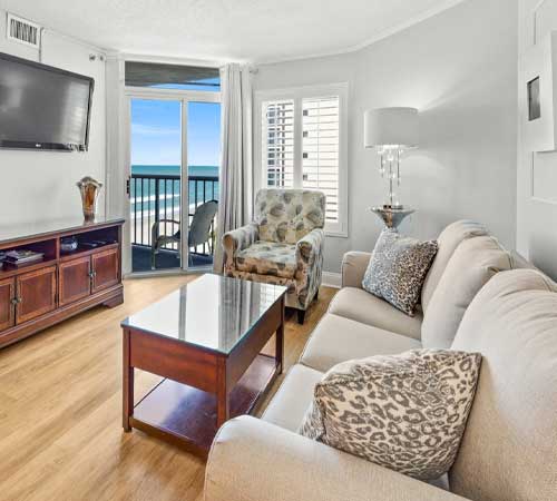 Living room with an oceanfront view at Sea Watch Resort